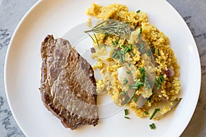 Home Cooking: grilled Steak with onions and herbes