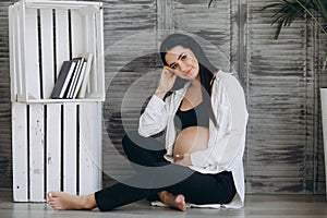 Home cozy portrait of pregnant woman resting at home