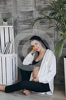 Home cozy portrait of pregnant woman resting at home