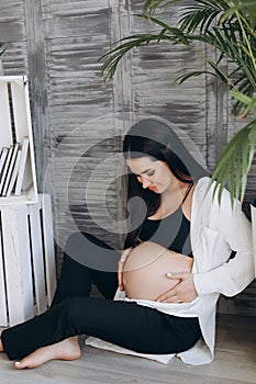 Home cozy portrait of pregnant woman resting at home