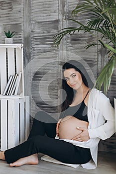 Home cozy portrait of pregnant woman resting at home