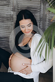 Home cozy portrait of pregnant woman resting at home