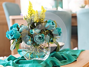 Home decor, blue flowers in the vase on the table