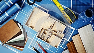 Home decorating tools standing on house bluprints. 3D illustration