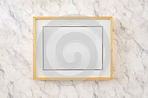 Home decoration, empty wooden picture frames, poster, blank canvas, mock up, on a marble wall, template front view