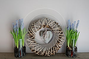 Home decoration, wreath with 2 glass vases next to it