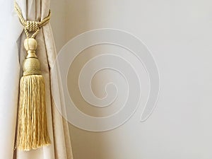 Curtains Tiebacks with golden tassels. copy space.