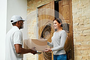 Home Delivery. Courier Delivering Package To Client