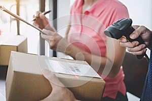 Home delivery service and working service mind, deliveryman working barcode scan checking order to confirm sending customer in