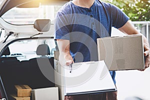 Home delivery service and working with service mind, deliveryman with boxes standing by in front of the customer house doors and