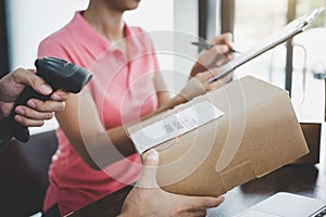 Home delivery service and working service mind, deliveryman working barcode scan checking order to confirm sending customer in