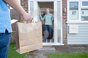 Home Delivery Of Takeaway Food Outside House Observing Safe Social Distancing During Coronavirus Covid-19 Pandemic