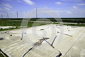 Home destroyed by hurricanes Laura and Delta in 2020 with uninhabited prairie landscape