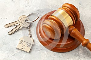 Home after divorce. Property section. Judge gavel and house keys. Buying or selling a home through auction