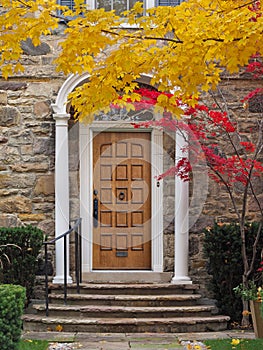 Home with elegant portico entrance and fall colors