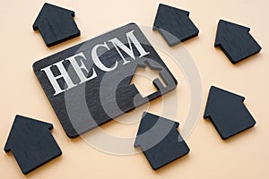 Home Equity Conversion Mortgage HECM sign on dark plate.