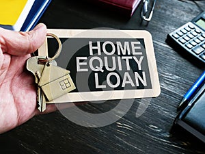 Home Equity Loan sign and key for house.