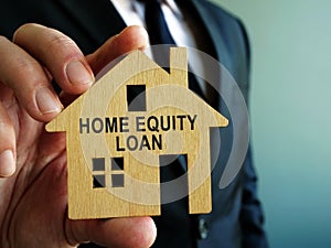 Home Equity Loan sign on a wooden model of house photo