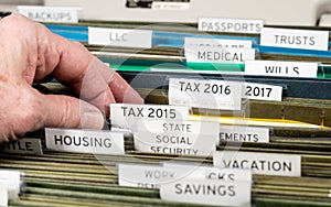Home filing system for taxes organized in folders