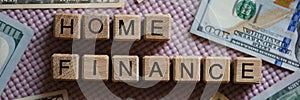 Home finance inscription on wooden cubes and cash