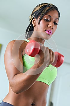 Home Fitness Black Woman Trains Biceps With Weights