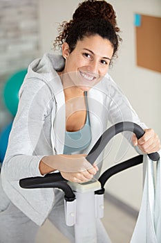 home fitness workout woman training on smart stationary bike i