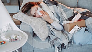 Home flu runny nose symptom suffering woman laying