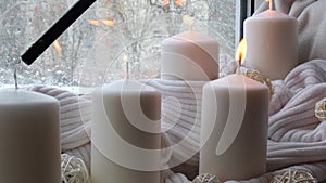 Home fragnance concept autumn holidays at cozy home on the windowsill Hygge aesthetic atmosphere on knitted white