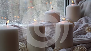 Home fragnance concept autumn holidays at cozy home on the windowsill Hygge aesthetic atmosphere on knitted white