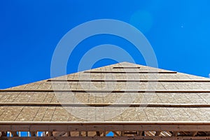 Home framing with roof for new residential construction.