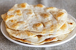 Home fried water-bisquits on white table, on canvas. Rustic style. Blurred background