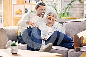 Home, funny and senior couple on a couch, love or relax with quality time marriage and romance. Romantic, old woman and
