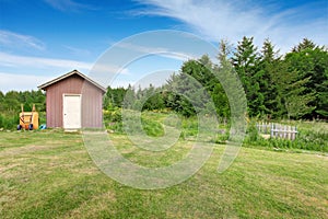 Home garden on backyard with small red shed