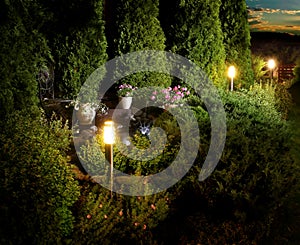 Home garden patio lights on evening dusk