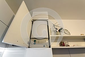 Home gas water heater boiler in kitchen furniture for apartment of home heating.