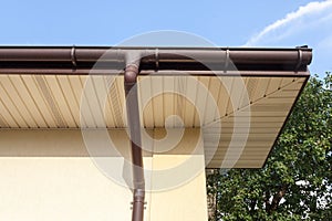 Home Guttering, Gutters, Plastic Guttering System, Guttering & Drainage Pipe Exterior against blue sky.