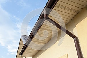 Home Guttering, Gutters, Plastic Guttering System, Guttering & Drainage Pipe Exterior against blue sky.