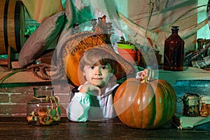 Home Halloween atmosphere. Happy kids on Halloween. Fairy. Halloween interior. Little boy Witch Ready for Trick or Treat
