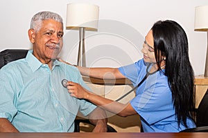 Home Health Care Nurse Assisting Elderly Patient