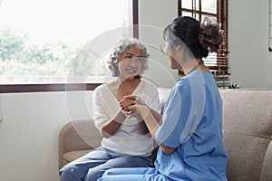 Home healthcare nurse, physical therapy with senior adult woman at home.