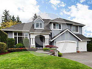 Home and healthy front yard during late spring season