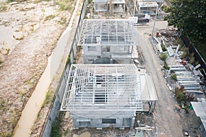 Home or house under construction in aerial view.
