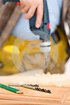 Home improvement - handyman drilling wood