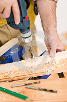 Home improvement - handyman drilling wood