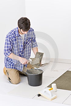 Home improvement - handyman laying tile