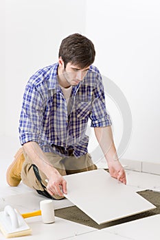 Home improvement - handyman laying tile