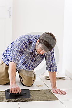 Home improvement - handyman laying tile