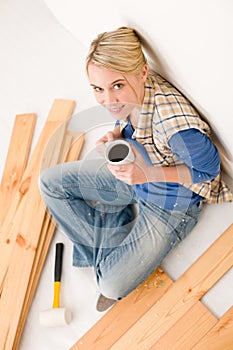 Home improvement - handywoman coffee break photo