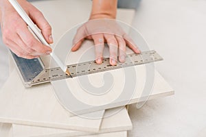 Home improvement - handywoman measuring tile photo