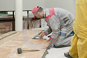 Home improvement, renovation - construction worker tiler is tili